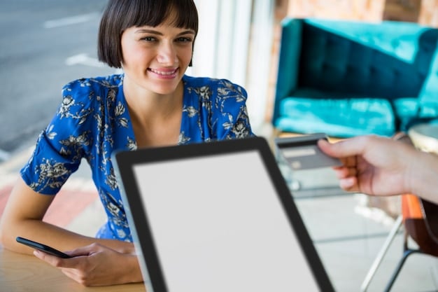 A customer showing a Best Buy price match policy on a tablet to a store employee at the customer service desk.