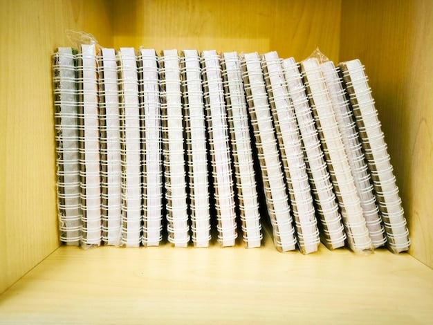 An overhead shot of a well-organized coupon binder with clear plastic sleeves, neatly sorted by category with labeled tabs, indicating a systematic approach to couponing.
