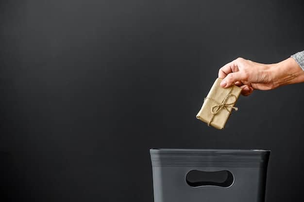 A person's hands sorting through a stack of coupons, discarding expired ones into a recycling bin.