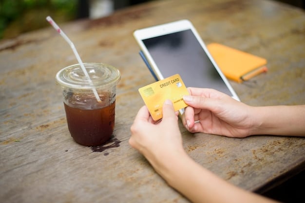 A close-up of a student's hands responsibly using a Discover it Student Cash Back Card to pay for groceries at a campus store, emphasizing smart spending.