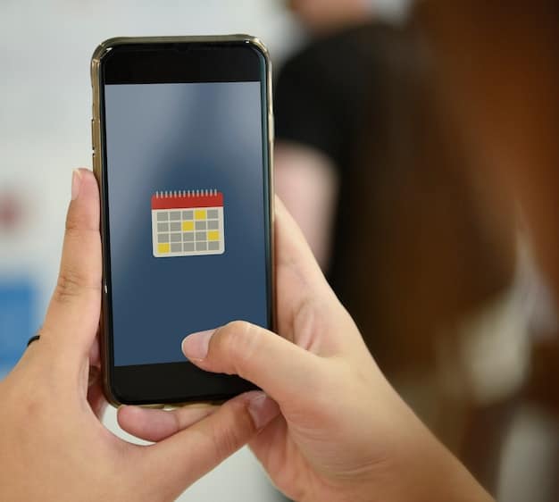 A hand holding a smartphone, with a calendar app open displaying reminders for activating credit card cashback categories, illustrating organization.