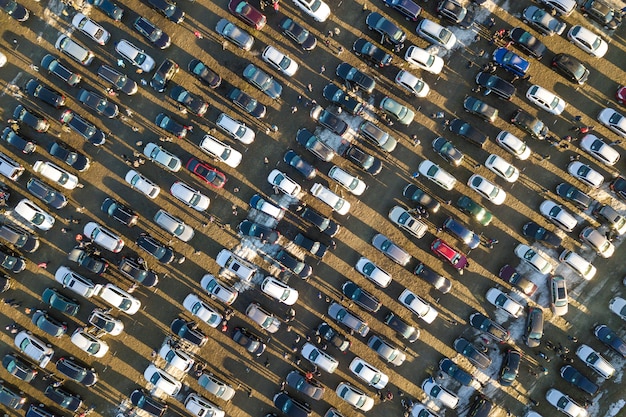 An aerial view of a busy cross-section of a city street, with cars moving in different directions, symbolizing the complex and interconnected flow of data on the internet, emphasizing the potential for unseen risks.